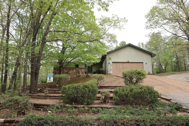 view of front of property with a garage and concrete driveway