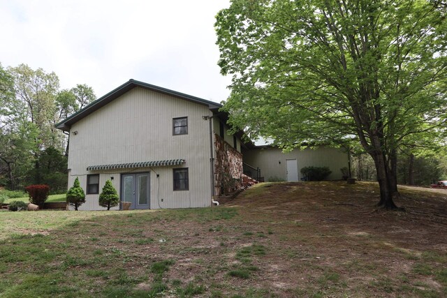 rear view of house featuring french doors