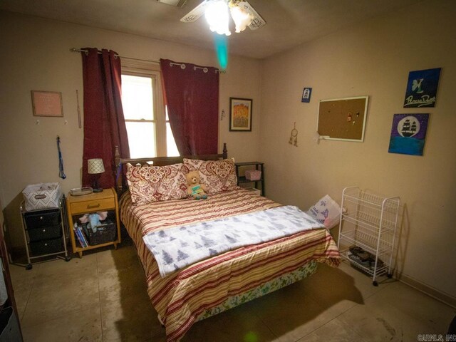 bedroom with tile patterned floors and a ceiling fan