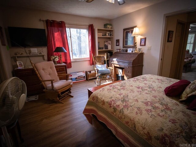 bedroom with wood finished floors