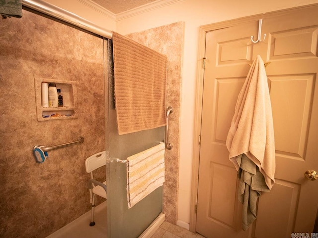 bathroom featuring tile patterned floors, a shower, and ornamental molding