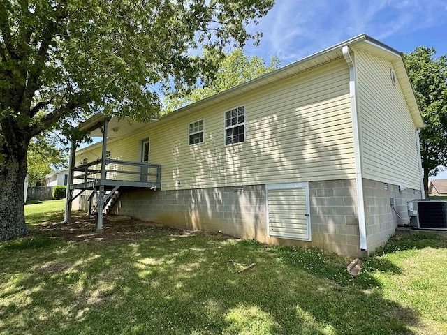 168 Knob Creek Rd, Melbourne, AR 72556 - rear view of house featuring a lawn, central AC, and stairs