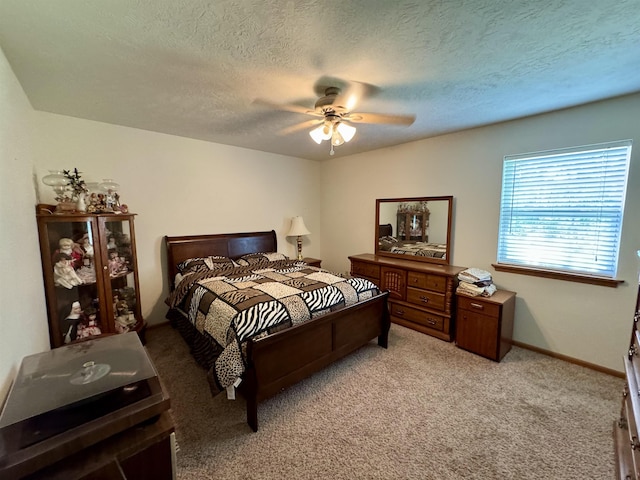 168 Knob Creek Rd, Melbourne, AR 72556 - bedroom with ceiling fan, light carpet, a textured ceiling, and baseboards