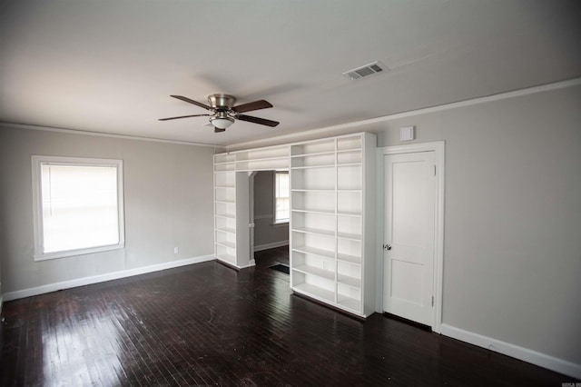 2713 S Van Buren St, Little Rock, AR 72204 - unfurnished bedroom with baseboards, visible vents, a ceiling fan, crown molding, and wood-type flooring