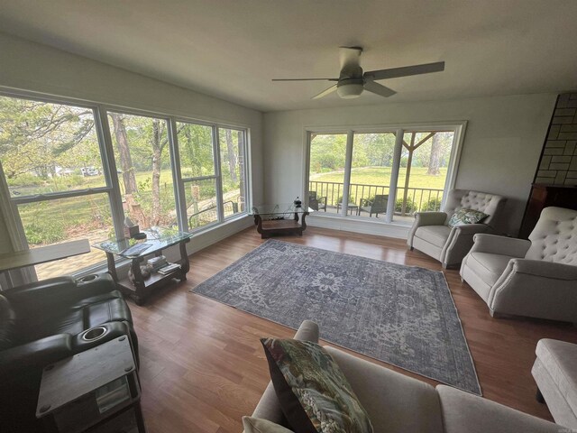 living room featuring wood finished floors and ceiling fan