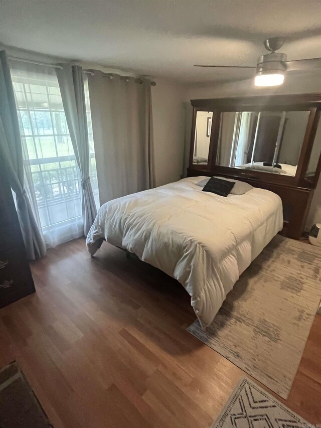 bedroom with wood finished floors and ceiling fan