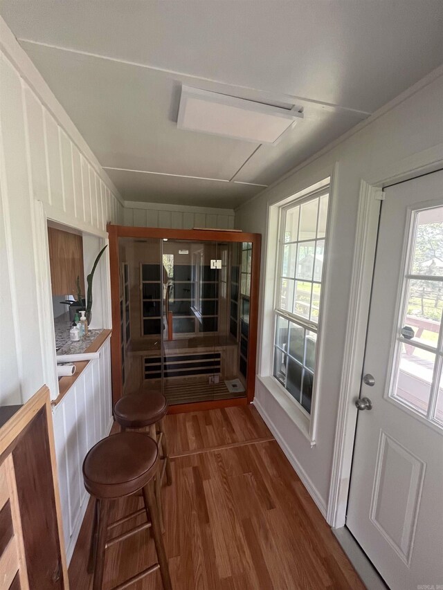 dining space with wood finished floors
