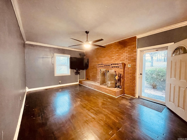 4500 Yvonne Dr, Little Rock, AR 72210 - unfurnished living room with a ceiling fan, crown molding, wood finished floors, baseboards, and a brick fireplace