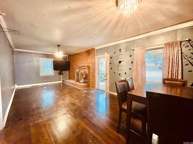 4500 Yvonne Dr, Little Rock, AR 72210 - living room featuring baseboards, wood finished floors, a fireplace, and crown molding