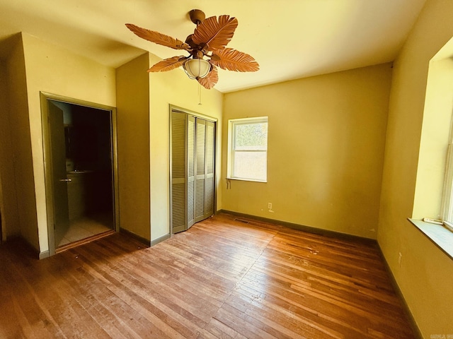 4500 Yvonne Dr, Little Rock, AR 72210 - unfurnished bedroom with baseboards, a closet, ceiling fan, and wood-type flooring
