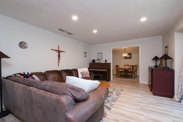7 Sandstone Ct, Little Rock, AR 72227 - living room featuring light wood-type flooring, visible vents, recessed lighting, and crown molding