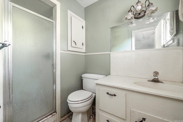 106 Nottingham Way, Prescott, AR 71857 - full bath featuring toilet, a wainscoted wall, vanity, and a stall shower