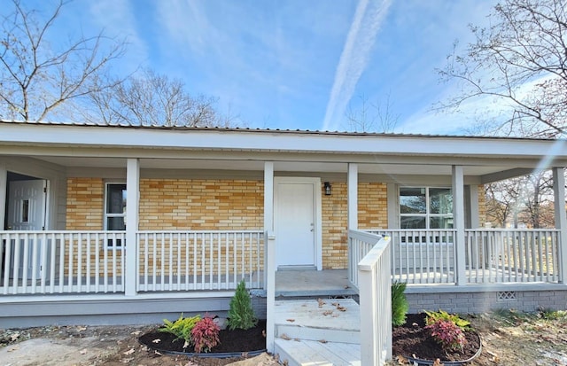 4920 Willow St, North Little Rock, AR 72118 - property entrance with brick siding and covered porch