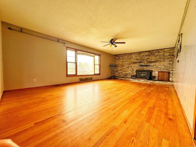 40 Sutton Ln, Batesville, AR 72501 - unfurnished living room with ceiling fan, light wood-style floors, and a textured ceiling