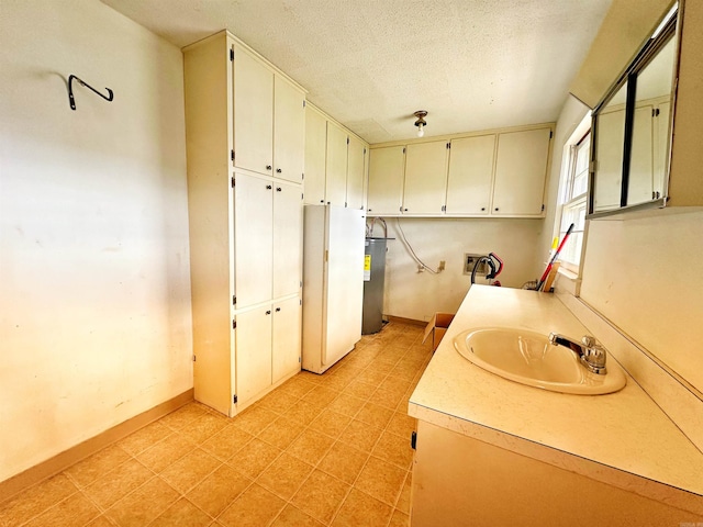 40 Sutton Ln, Batesville, AR 72501 - bathroom with a textured ceiling, tile patterned floors, baseboards, and a sink