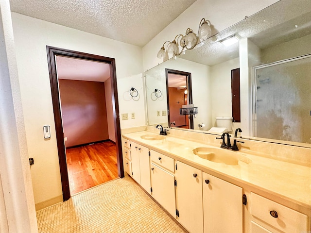 40 Sutton Ln, Batesville, AR 72501 - full bathroom with a shower stall, toilet, a sink, and double vanity