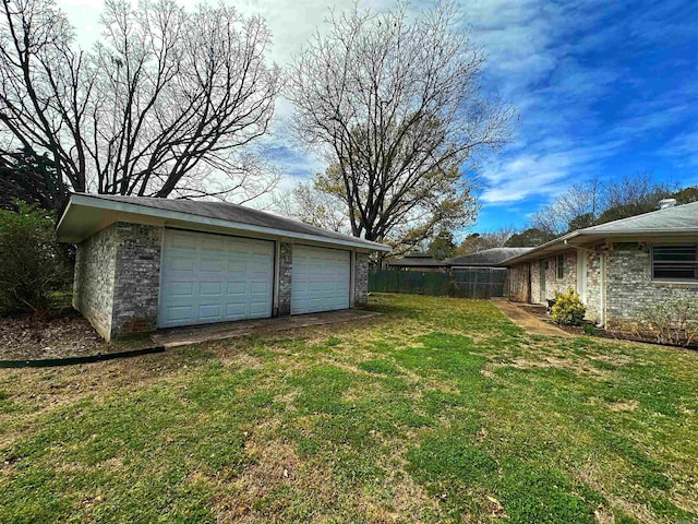 40 Sutton Ln, Batesville, AR 72501 - view of yard with an outdoor structure, fence, and a detached garage