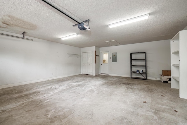 garage with a garage door opener and electric panel