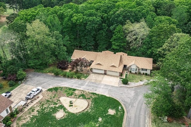 aerial view featuring a wooded view