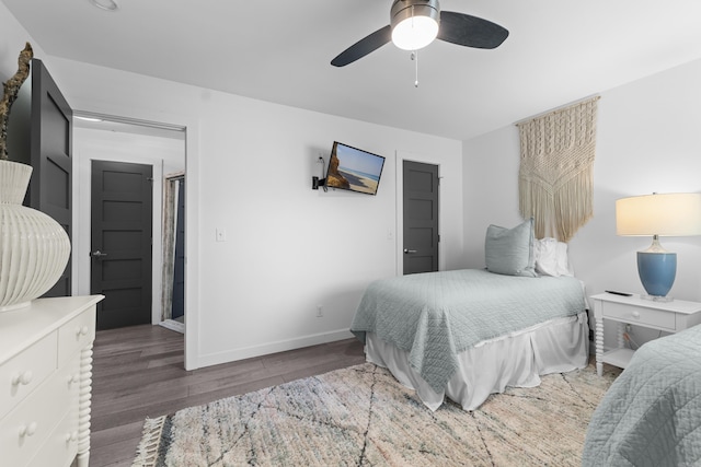 bedroom with wood finished floors, baseboards, and ceiling fan