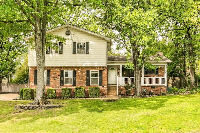 2312 Breckenridge Dr, Little Rock, AR 72227 - view of front of house featuring a porch, fence, brick siding, and a front yard