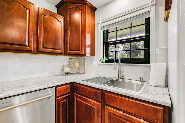 2312 Breckenridge Dr, Little Rock, AR 72227 - kitchen with light stone countertops, stainless steel dishwasher, a sink, and tasteful backsplash