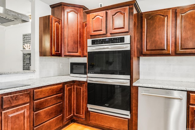 2312 Breckenridge Dr, Little Rock, AR 72227 - kitchen with light stone countertops, stainless steel appliances, tasteful backsplash, and wall chimney range hood