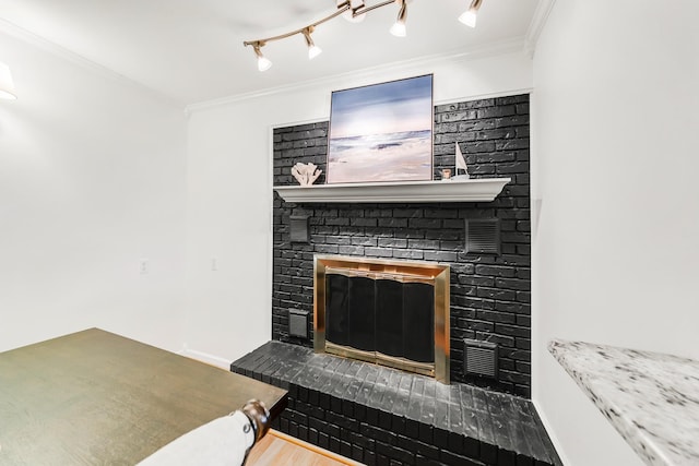 2312 Breckenridge Dr, Little Rock, AR 72227 - interior details with visible vents, wood finished floors, a fireplace, and ornamental molding
