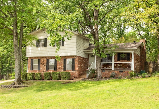2312 Breckenridge Dr, Little Rock, AR 72227 - split level home featuring fence, covered porch, a front lawn, and brick siding