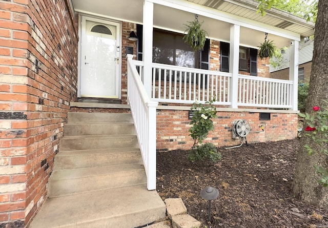 2312 Breckenridge Dr, Little Rock, AR 72227 - entrance to property featuring brick siding and a porch
