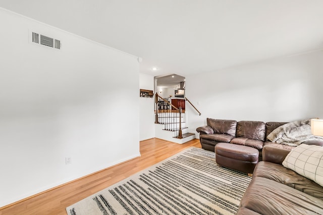 2312 Breckenridge Dr, Little Rock, AR 72227 - living area with stairway, wood finished floors, baseboards, visible vents, and recessed lighting