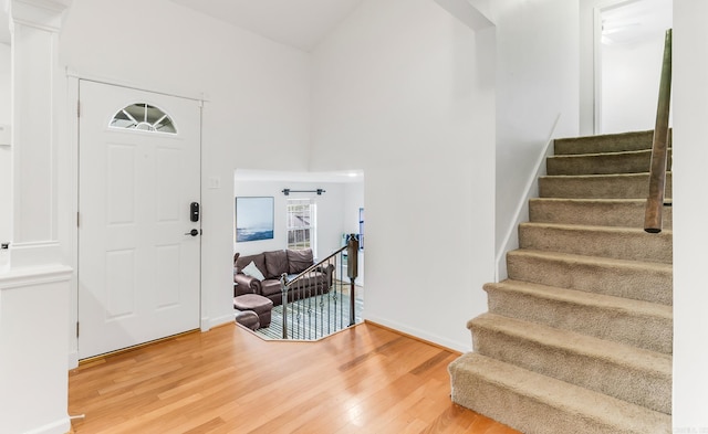 2312 Breckenridge Dr, Little Rock, AR 72227 - foyer entrance featuring wood finished floors, baseboards, and stairway