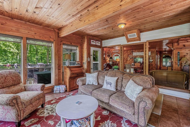 tiled living area with wood ceiling and visible vents