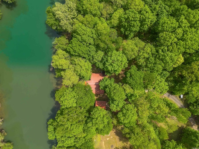 birds eye view of property with a view of trees