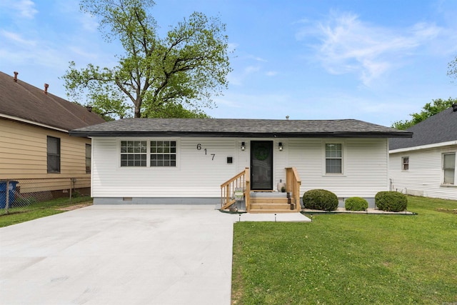 ranch-style home featuring fence, driveway, crawl space, and a front lawn