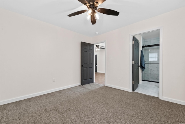 unfurnished bedroom featuring ensuite bathroom, ceiling fan, light colored carpet, and baseboards
