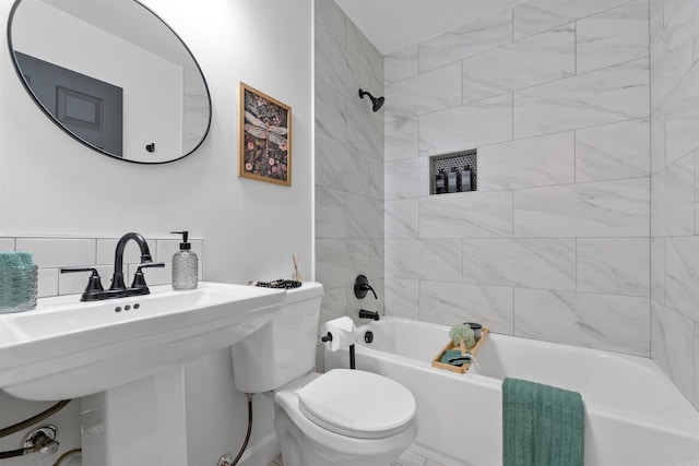 full bathroom with tasteful backsplash, toilet, and shower / bathtub combination
