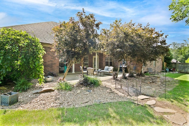 26 Shiloh S, Cabot, AR 72023 - back of house with brick siding, a patio area, and roof with shingles
