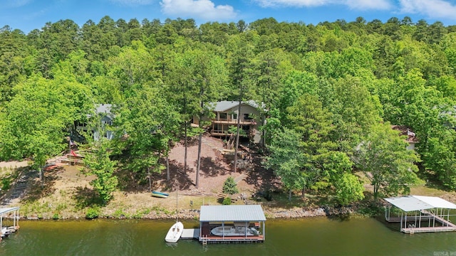 drone / aerial view with a view of trees and a water view