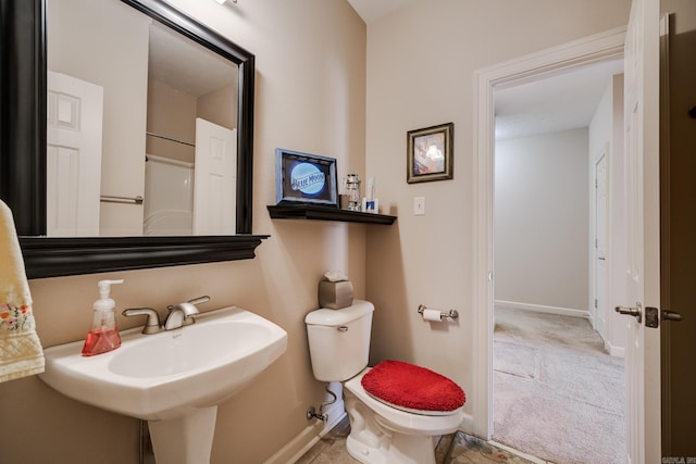 505 Fieldstone, Conway, AR 72034 - bathroom featuring baseboards, a sink, and toilet