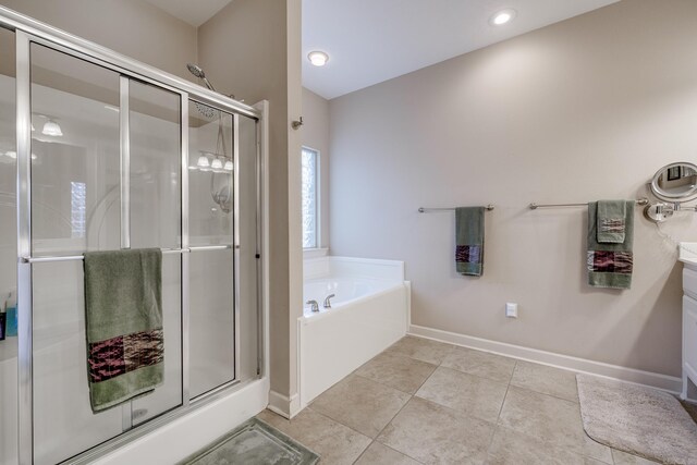 505 Fieldstone, Conway, AR 72034 - full bath with baseboards, tile patterned flooring, a shower stall, and a bath