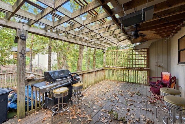 wooden terrace featuring a pergola and ceiling fan