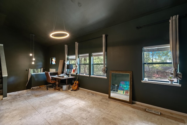 office with a wealth of natural light, visible vents, and a chandelier