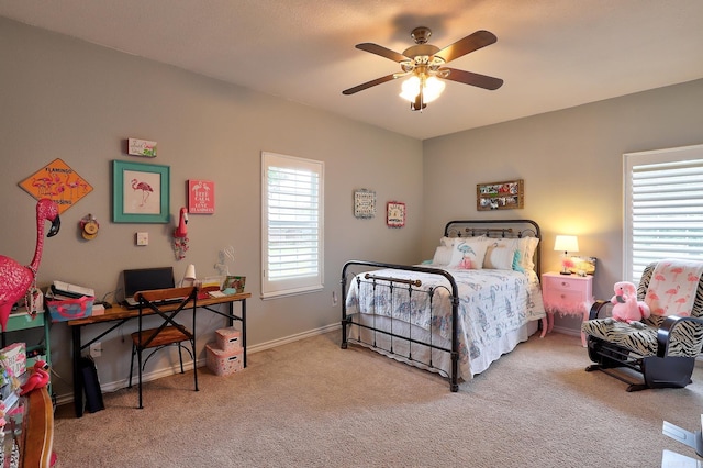 carpeted bedroom featuring a ceiling fan and baseboards