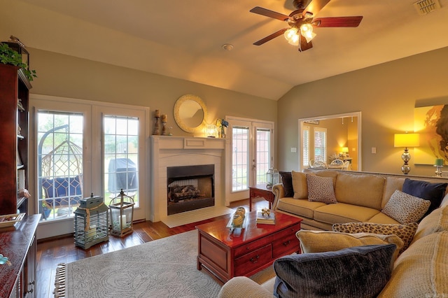 living room featuring a wealth of natural light, french doors, ceiling fan, and visible vents