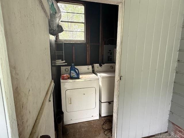 washroom with washer and dryer, electric panel, and laundry area