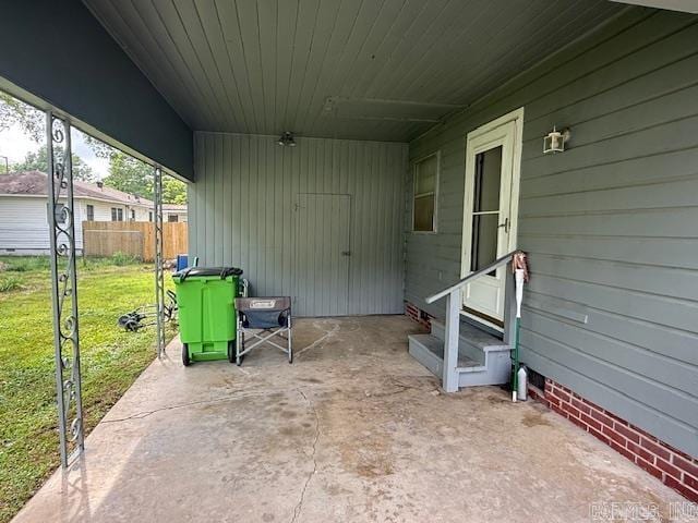 view of patio / terrace with entry steps and fence