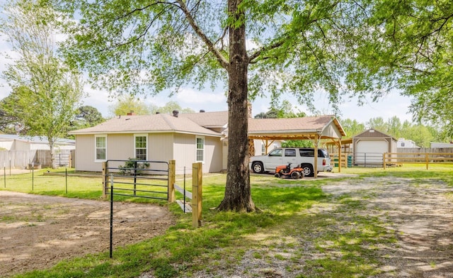8033 Renee Cir, Benton, AR 72019 - single story home with fence, a carport, an outbuilding, and a front yard
