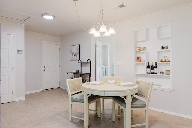 8033 Renee Cir, Benton, AR 72019 - dining area with light tile patterned floors, attic access, baseboards, visible vents, and a notable chandelier