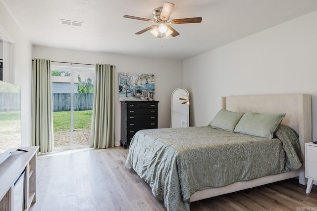 8033 Renee Cir, Benton, AR 72019 - bedroom featuring a ceiling fan, access to exterior, visible vents, and light wood-style flooring